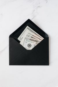 Stock image of money in an envelope