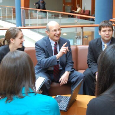 Image of Bill Novelli with students
