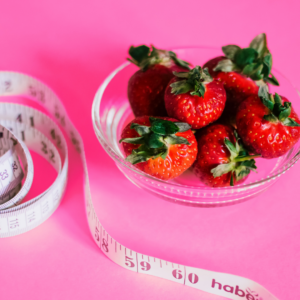 Image of strawberries and tape measure - portion balance