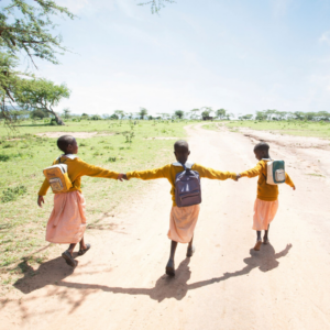 Image of little girls walking hand in hand