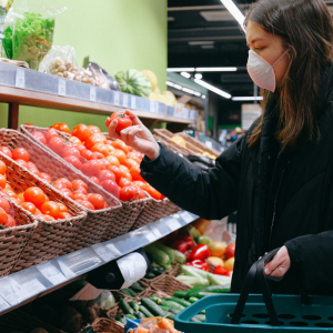 Stock image a female grocery shopping for healthy food