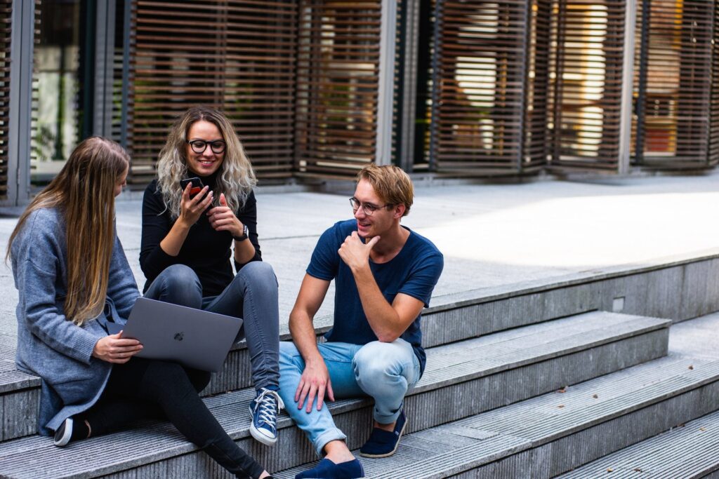 Students sitting on the stairs talking