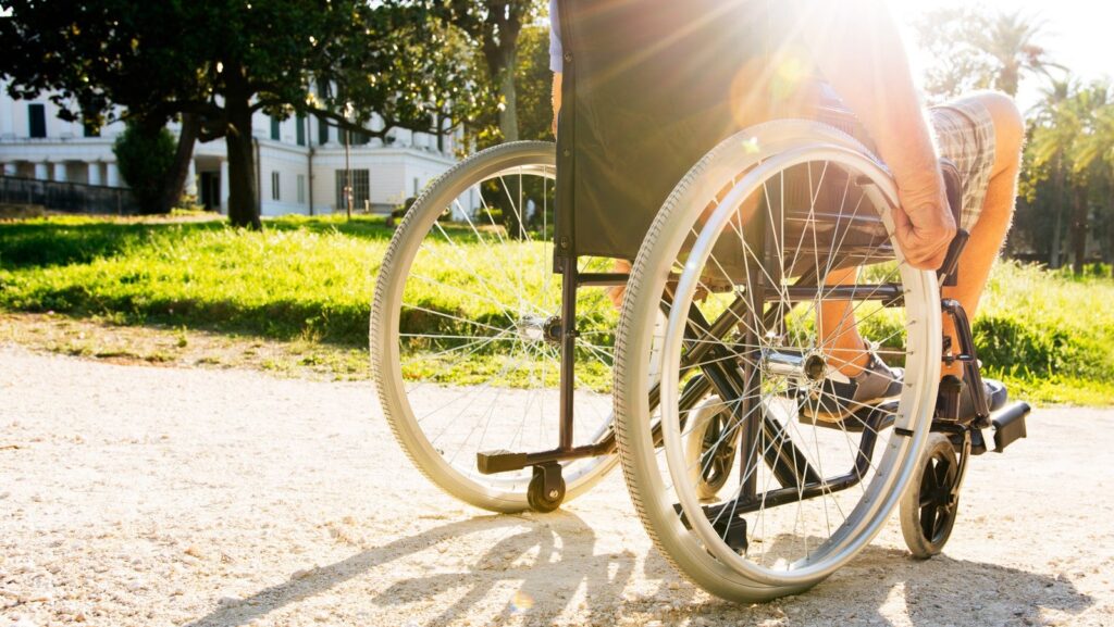 Man on wheelchair in a park