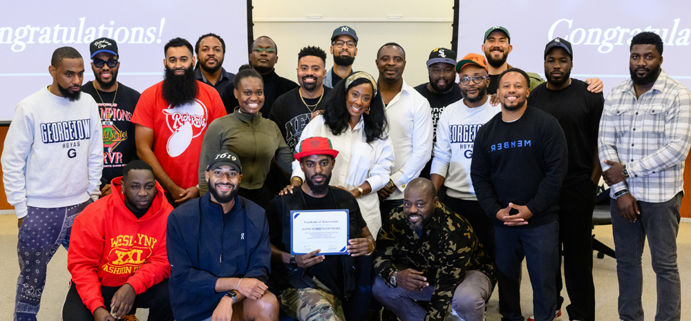 A bunch of cool students look happy in a Georgetown classroom